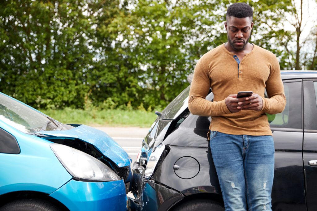 man on phone after car accident